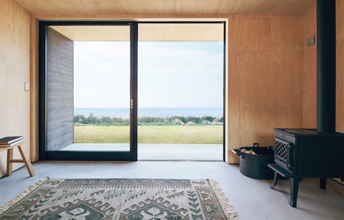 cabane muji vitres poele tapis vue mer