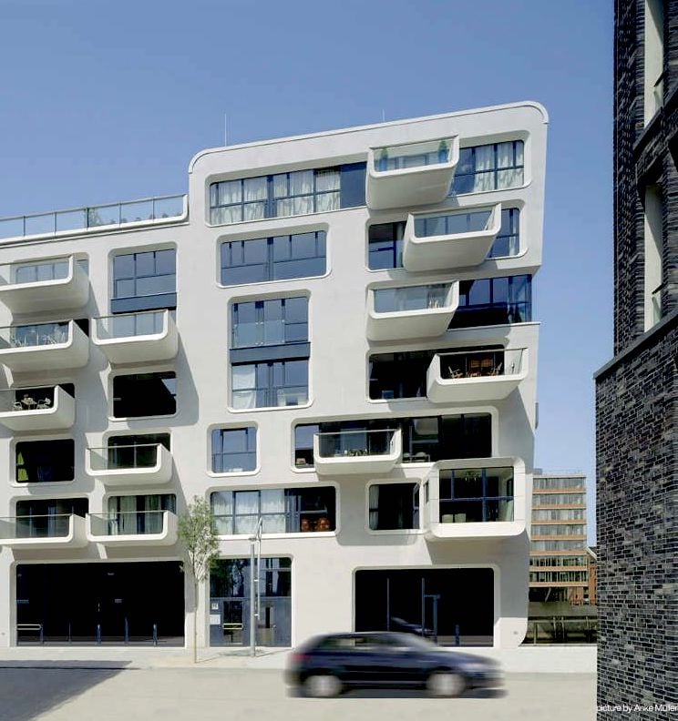 bâtiment balcon rond design contemporain baie vitrée