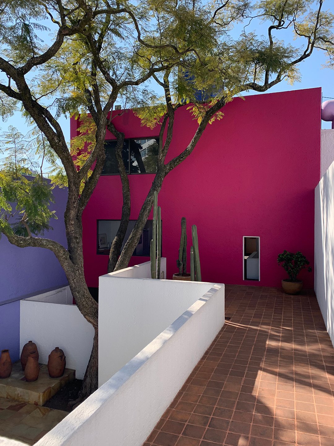 maison toit plat balcon pierre brique rouge