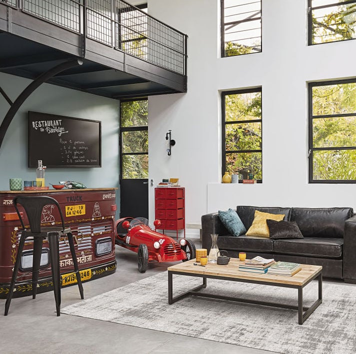 canapé droit fauteuil bleu rond table basse bois métal noir