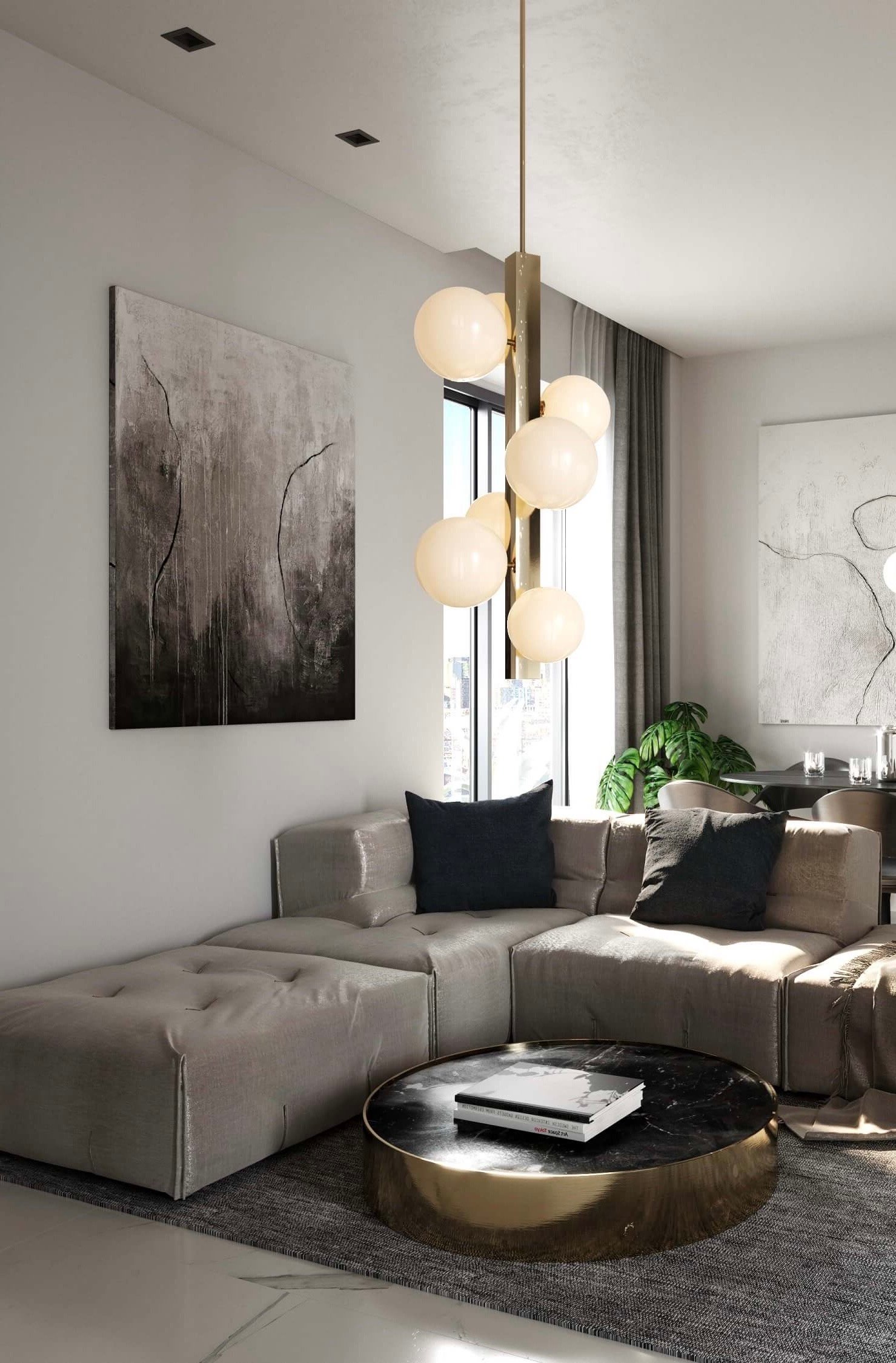 salon canapé modulable gris table basse ronde marbre laiton