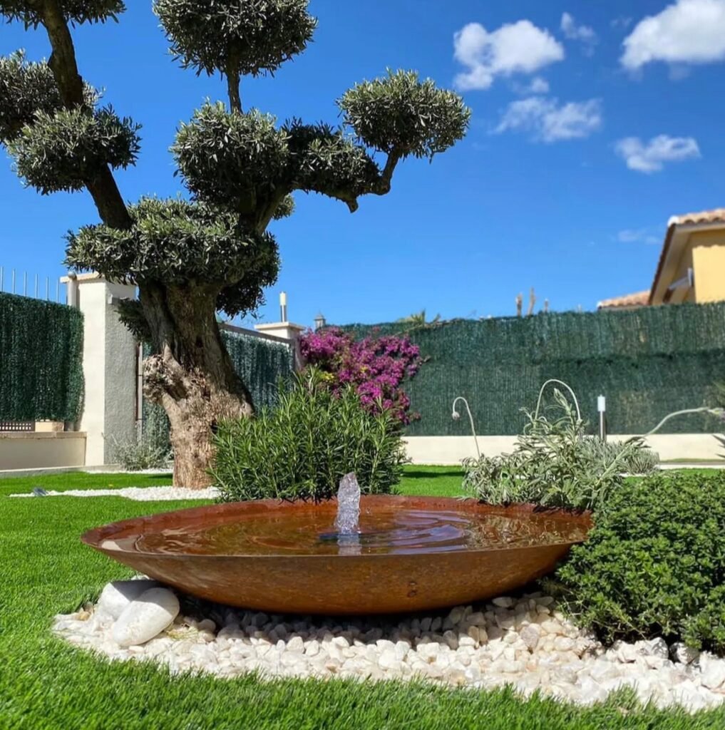 salon exterieur fontaine socle terre cuite couleur cuivre