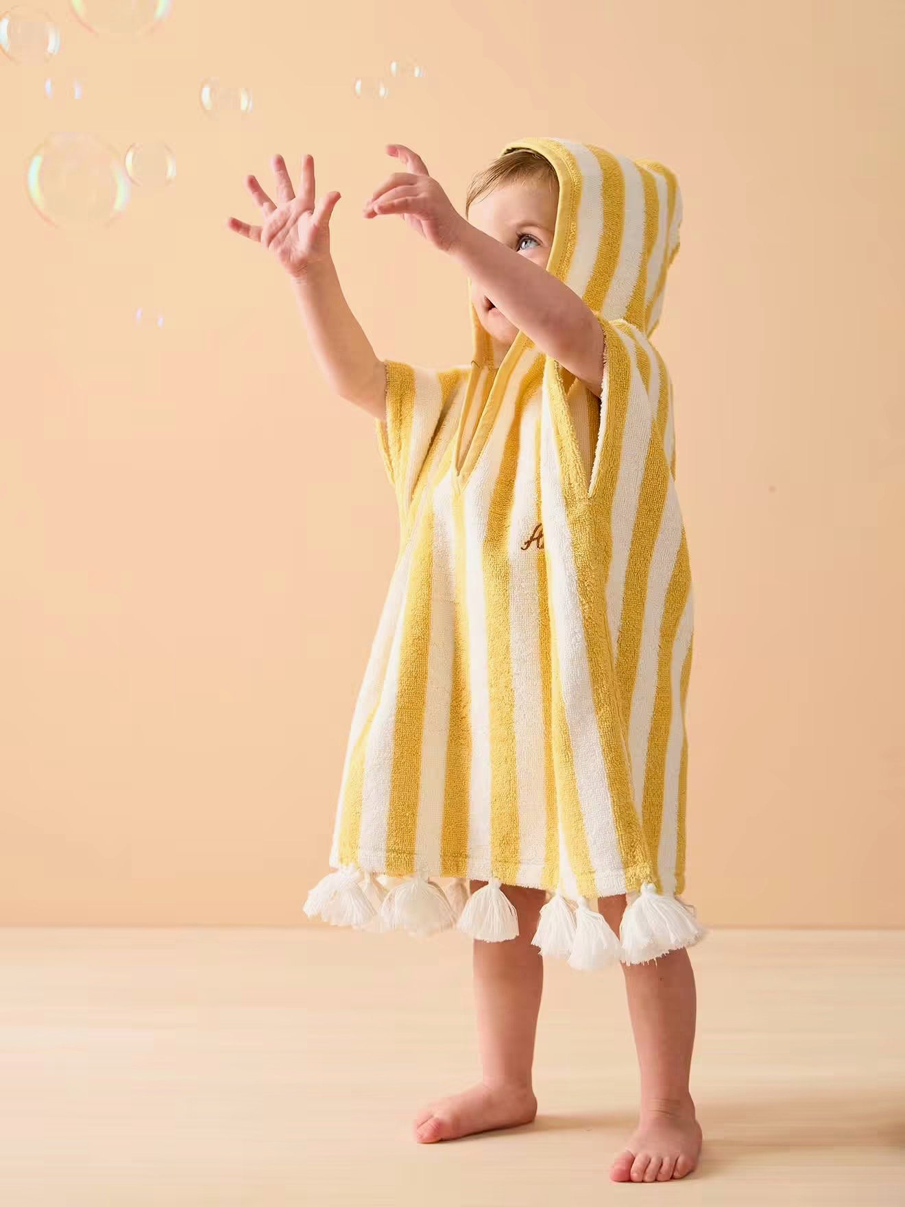 poncho bain capuche rayures plage