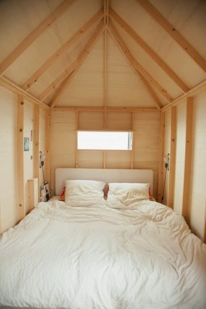Chambre parentale cabane en bois sous les toits cocon.