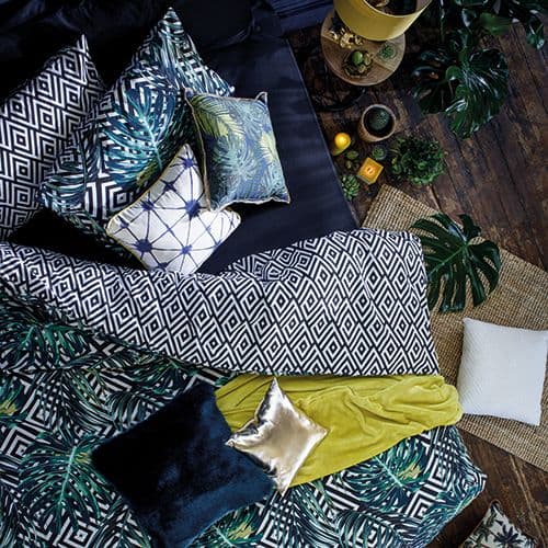 chambre tropicale linge lit coussins couette couleurs