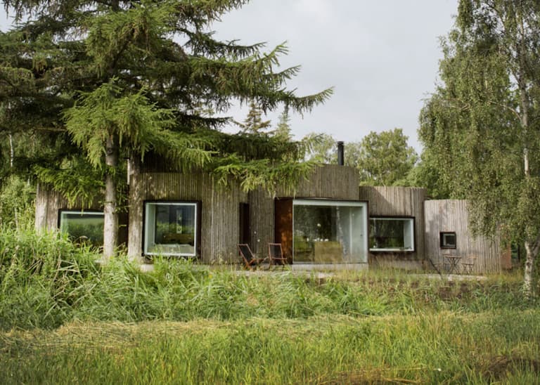 maison cylindrique exterieure cache bois rondins foret vert bois rondins vue sapin ciel