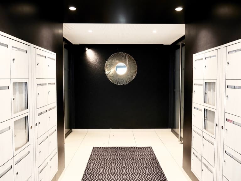 villa Condroyer cogedim parties communes entrée immeuble noir blanc design