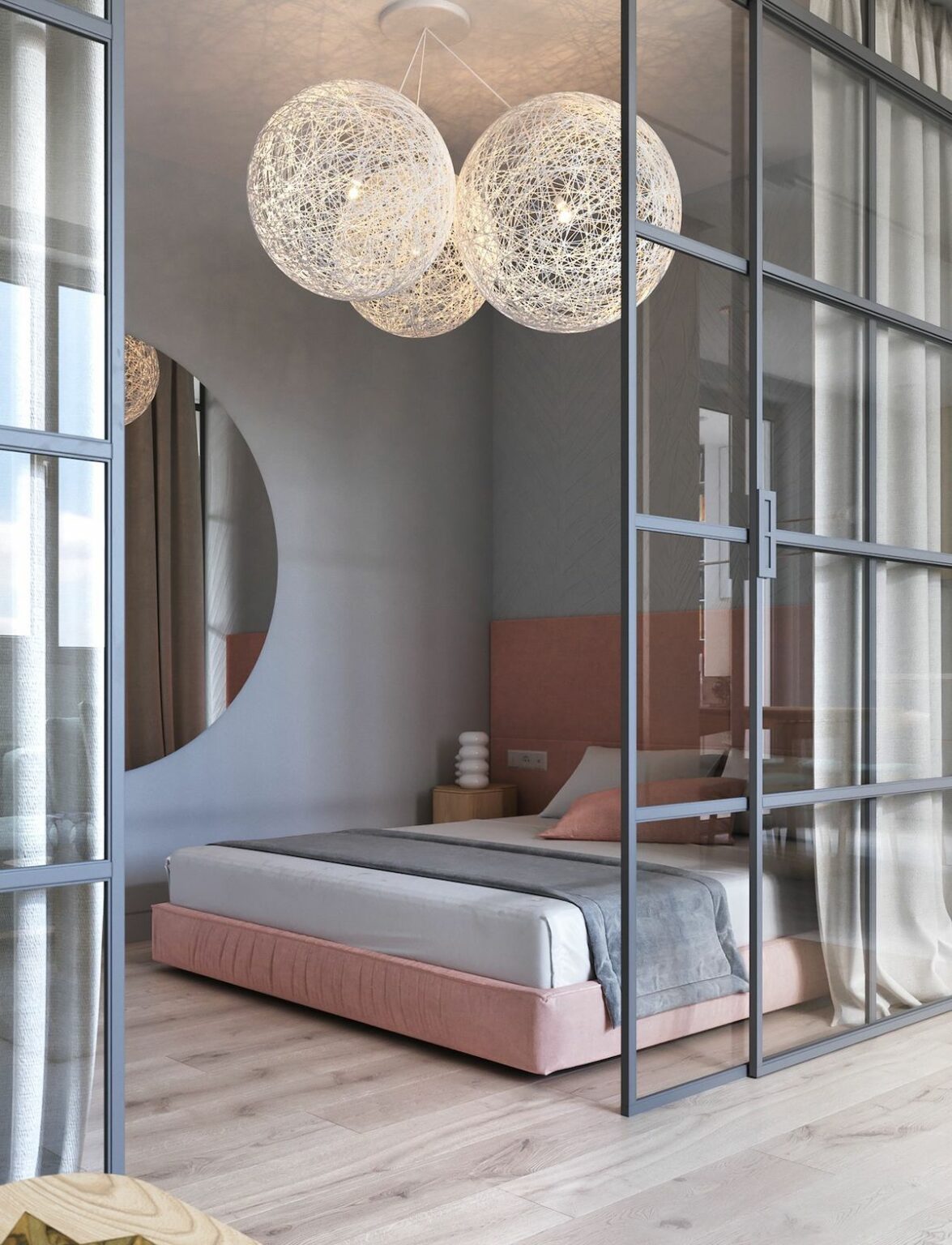 chambre parentale lit double gris rose pâle miroir rond porte vitrée