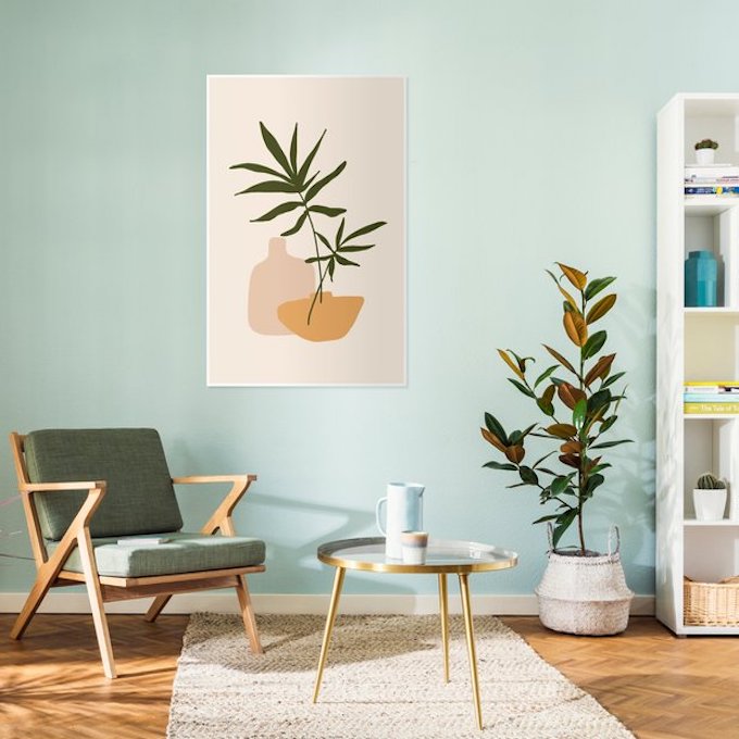 salon épuré minimaliste mur vert pastel armoire table basse laiton
