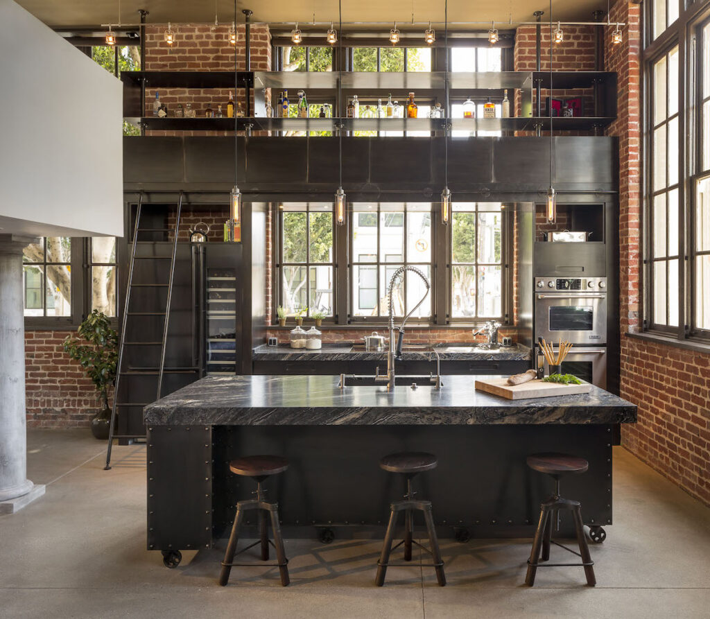 cuisine ouverte loft mur brique meuble acier