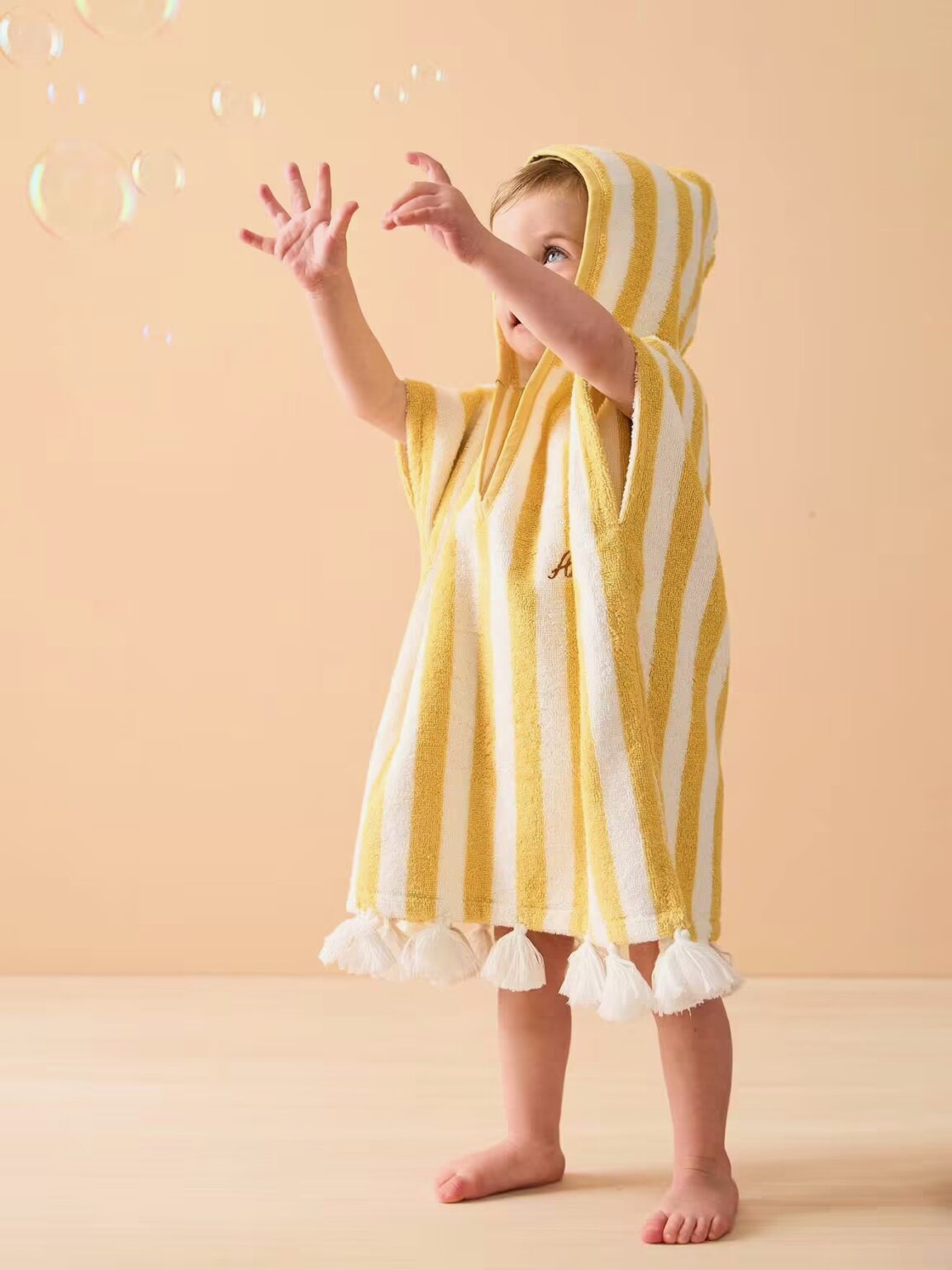 poncho bain capuche rayures plage